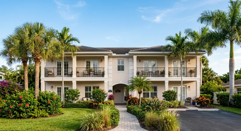 Well-maintained Florida rental property with palm trees